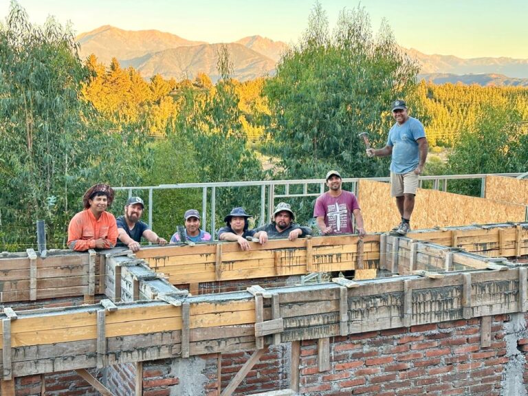 Aerial view of the construction site with the Andes in the background