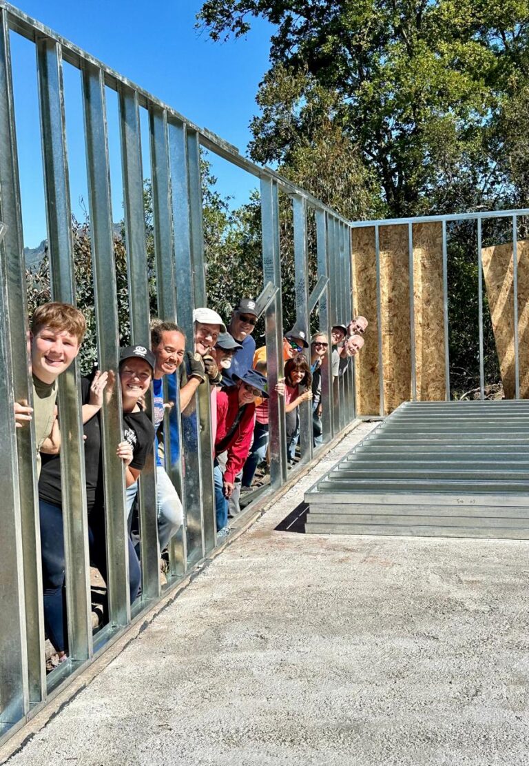 Volunteers assembling the steel frame for Phase One